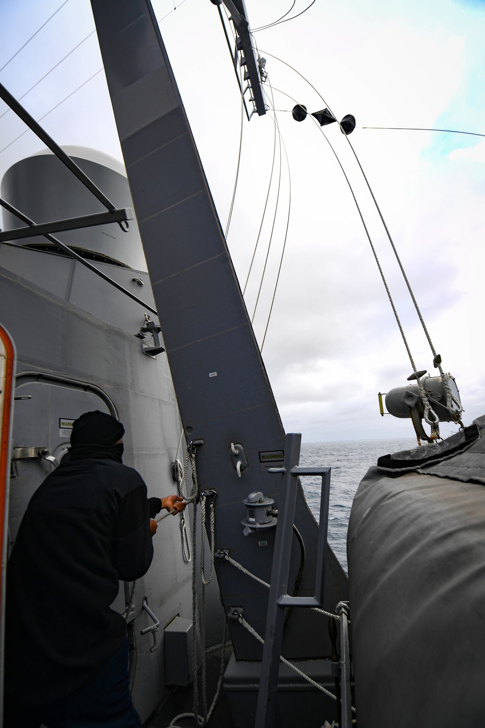 USS Thomas Hudner (DDG 116) Participates in a Replenishment-at-Sea With MV Asterix During Nanook 2020