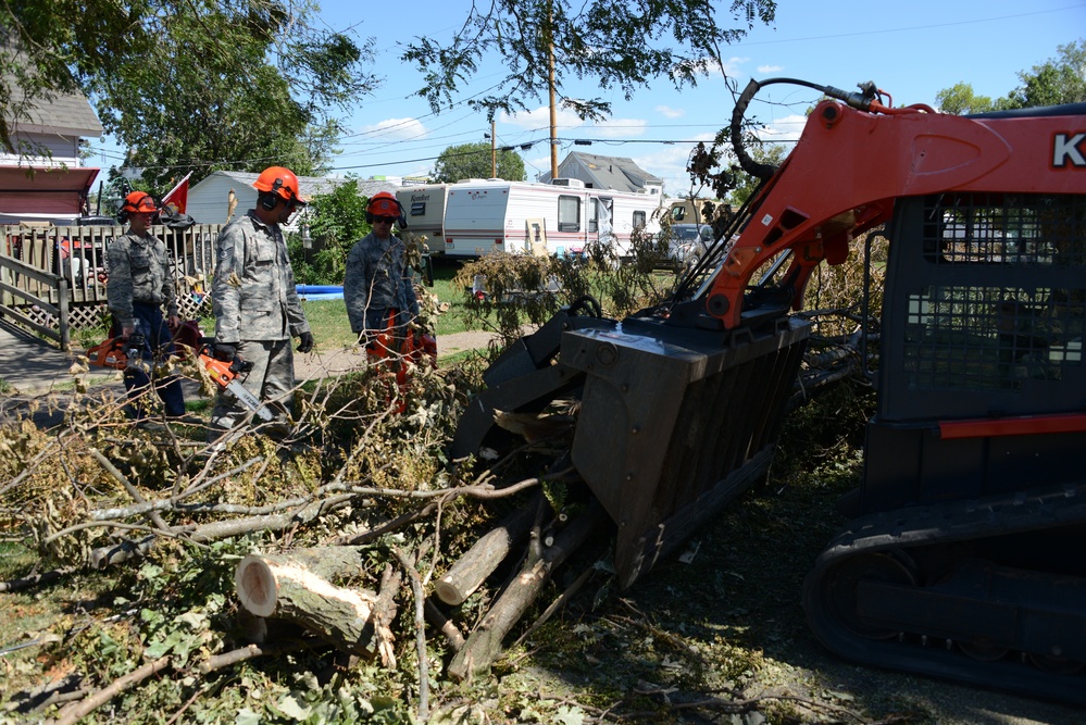 CE Airmen clear trees with skid loader