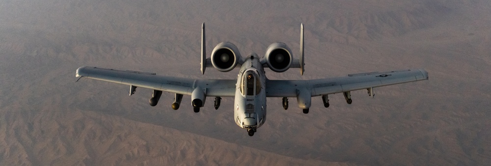 A U.S. Air Force KC-135 Stratotanker refuels A-10 Thunderbolts.