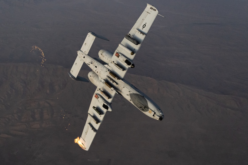 A U.S. Air Force KC-135 Stratotanker refuels A-10 Thunderbolts.