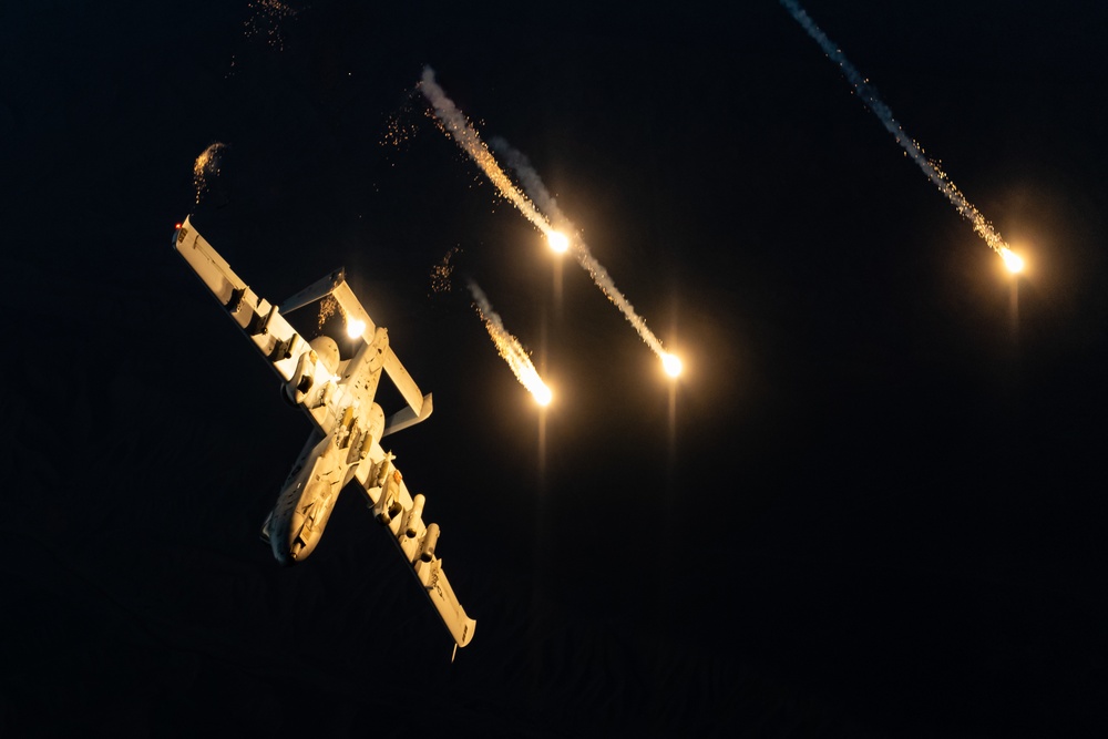 A U.S. Air Force KC-135 Stratotanker refuels A-10 Thunderbolts.