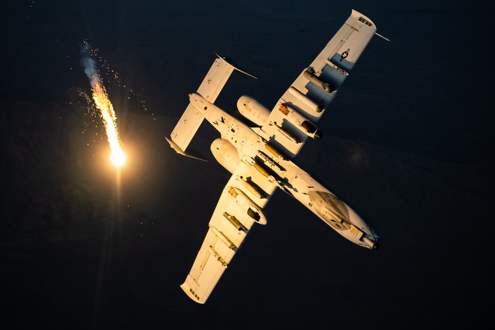 A U.S. Air Force KC-135 Stratotanker refuels A-10 Thunderbolts.