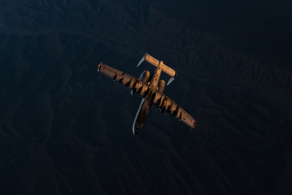 A U.S. Air Force KC-135 Stratotanker refuels A-10 Thunderbolts.