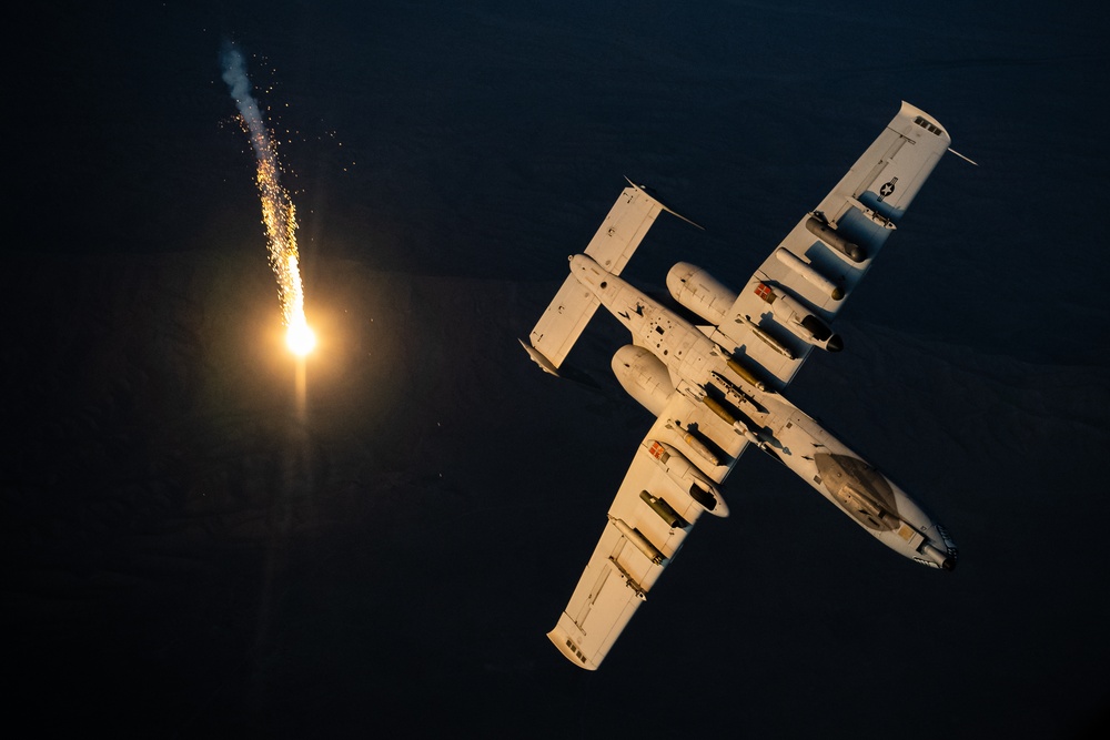 A U.S. Air Force KC-135 Stratotanker refuels A-10 Thunderbolts.