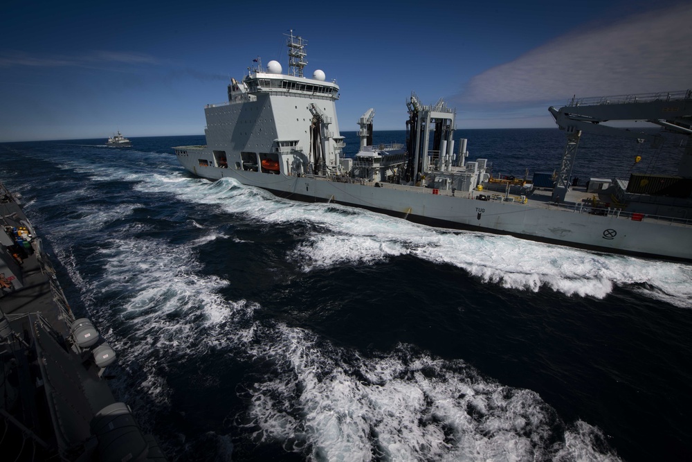 USS Thomas Hudner (DDG 116) Participates in Replenishment-at-Sea with Royal Canadian Ship MV Asterix and Royal Canadian Navy Halifax-class frigate HMCS Ville de Québec (FFH 332) During Operation Nanook