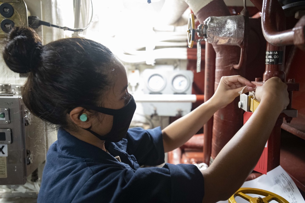 USS Ralph Johnson Sailors conduct maintenance