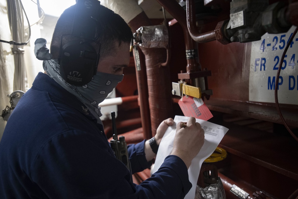 USS Ralph Johnson Sailors conduct maintenance