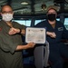 USS Carl Vinson (CVN 70) Sailor Receives Sailor of the Day Certificate