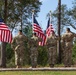 Soldiers salute the flag during the ceremony.