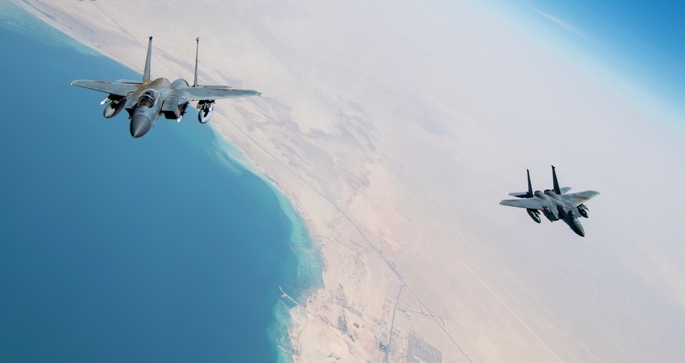 F-15Cs fly over the Arabian Gulf