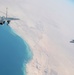 F-15Cs fly over the Arabian Gulf