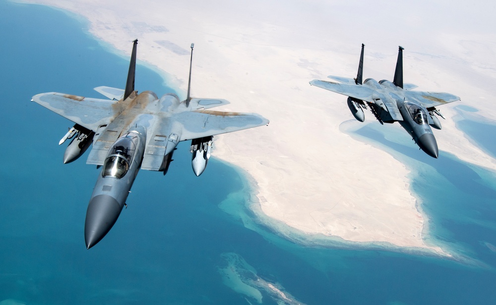 F-15Cs fly over the Arabian Gulf