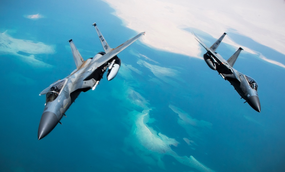 F-15Cs fly over the Arabian Gulf