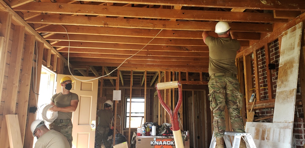 Army electricians work on building renovation
