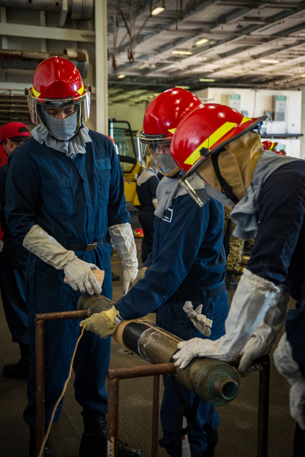USS Carl Vinson (CVN 70) Sailors Particpate In Pipe Patching Drill