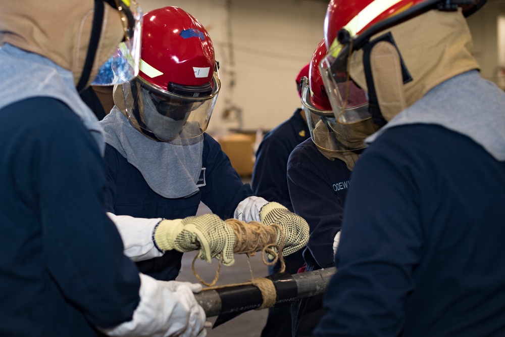 USS Carl Vinson (CVN 70) Sailors Participate In Pipe Patching Drill