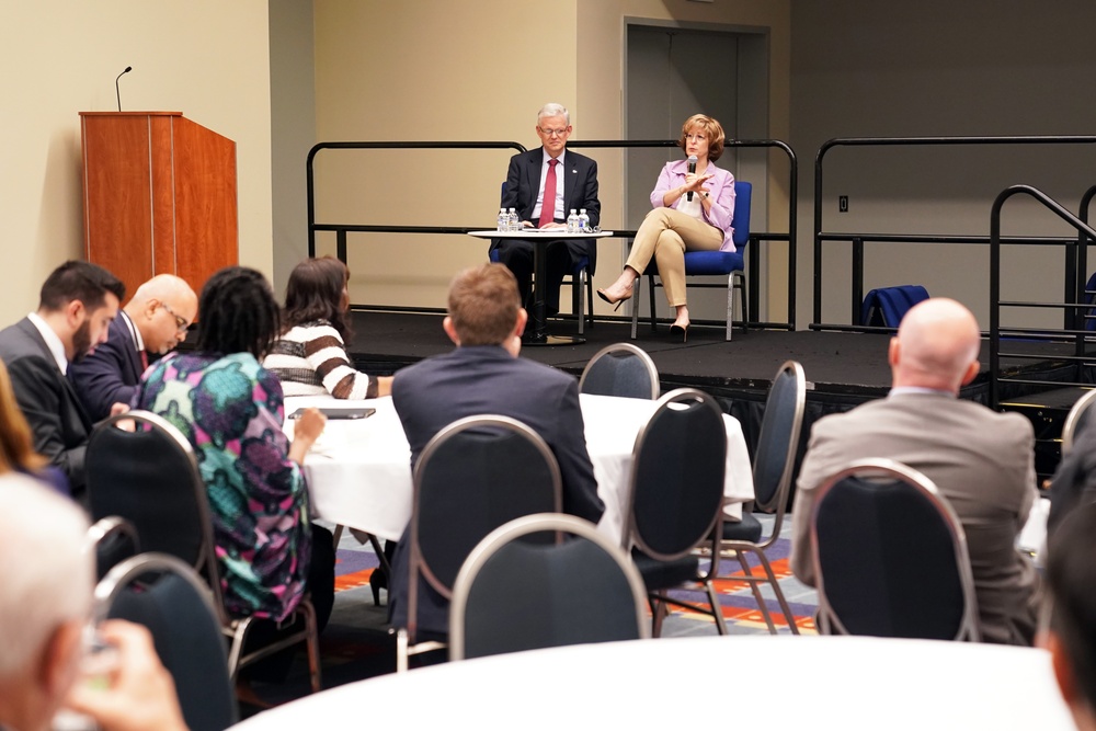 DAAID Bonnie Glick sits in on a fireside chat at InterAction