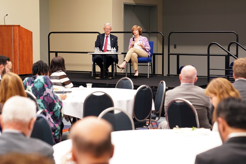 DAAID Bonnie Glick sits in on a fireside chat at InterAction