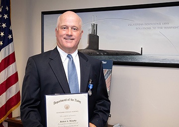 Retired NUWC Division Newport employee receives Superior Civilian Service Award