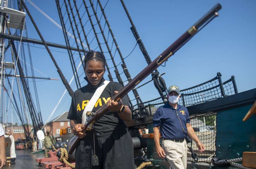 Service member loads musket