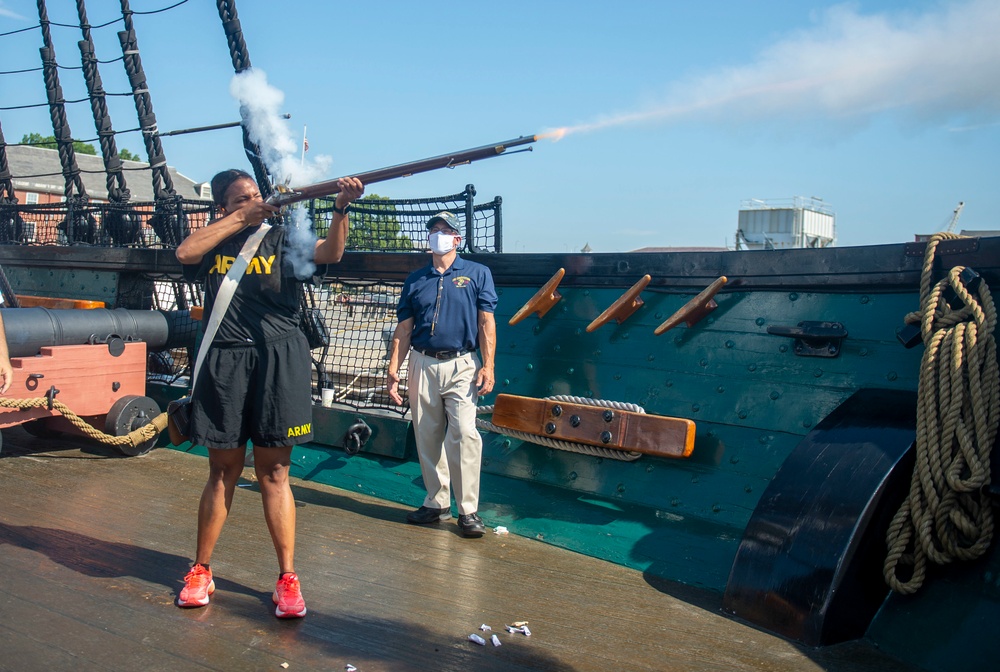 Service member fires musket