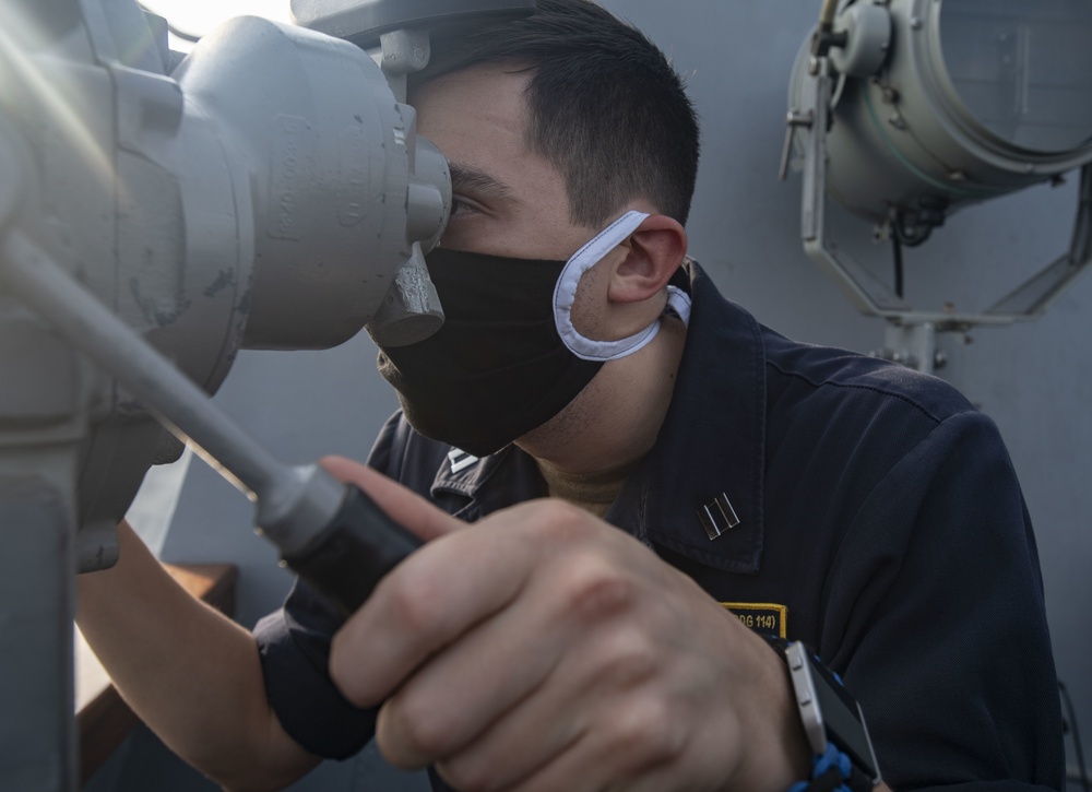 USS Ralph Johnson Sailors monitors for Surface and Air Contacts