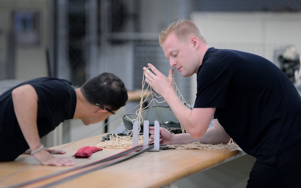 USAJFKSWCS Riggers Repack Parachutes