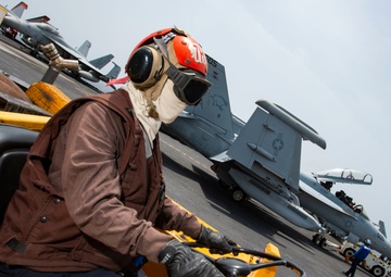 Aviation Structural Mechanic Operates Scrubby On Flight Deck Aboard Aircraft Carrier USS Nimitz CVN 68