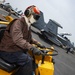 Aviation Structural Mechanic Operates Scrubby On Flight Deck Aboard Aircraft Carrier USS Nimitz CVN 68