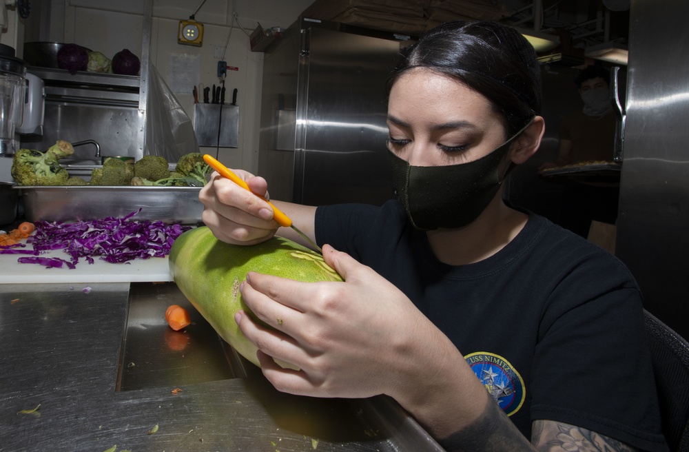 Culinary Specialist Prepares Squash Decoration Aboard Aircraft Carrier USS Nimitz CVN 68