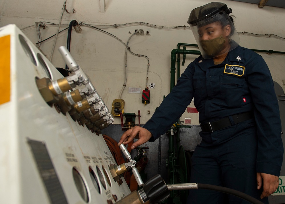 Nimitz CSG Sailor Processes Ship’s Store Transaction