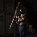 Aviation Boatswain's Mate (Handling) Spins Ceremonial Rifle During Nimitz Honor Guard Practice In Hangar Bay Aboard Aircraft Carrier USS Nimitz CVN 68