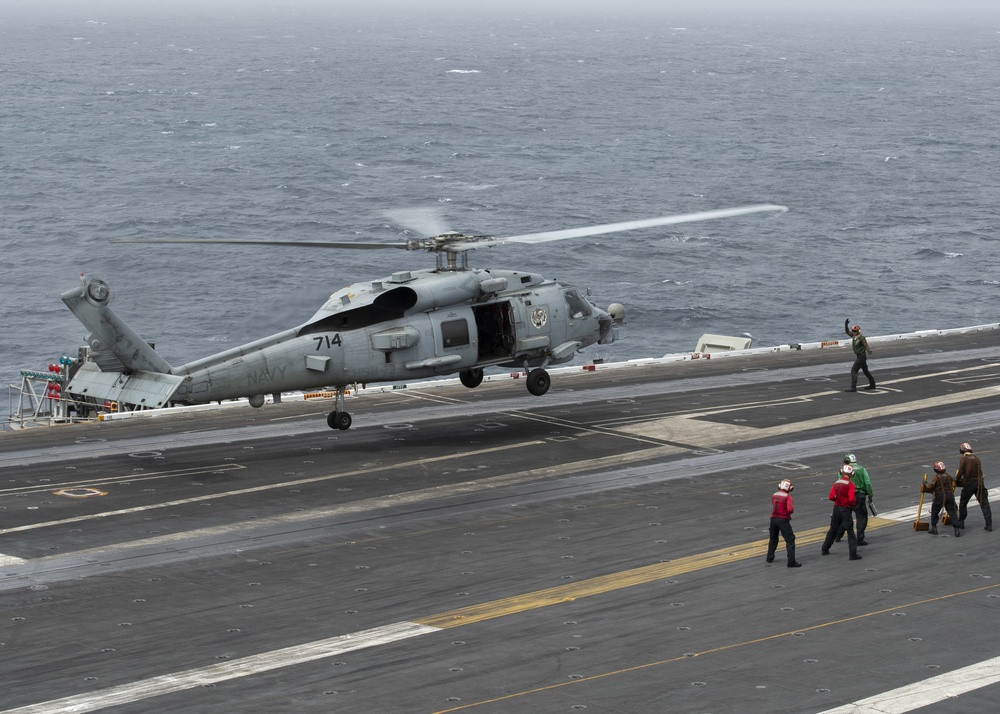 Helicopter Lands On Flight Deck