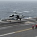 Helicopter Lands On Flight Deck