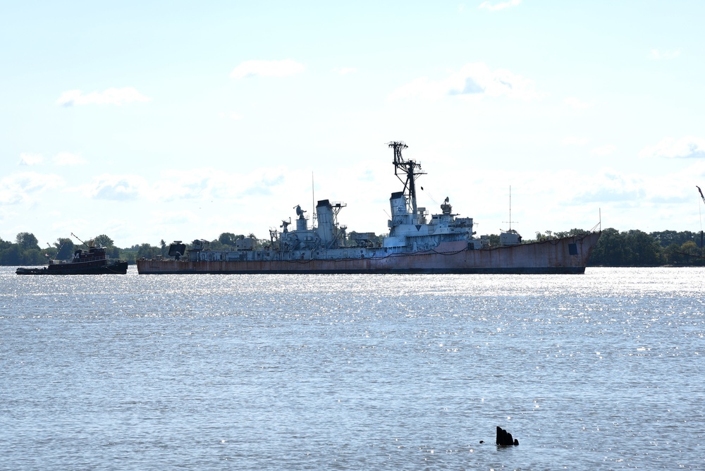 USS Charles F. Adams is towed through the Delaware River
