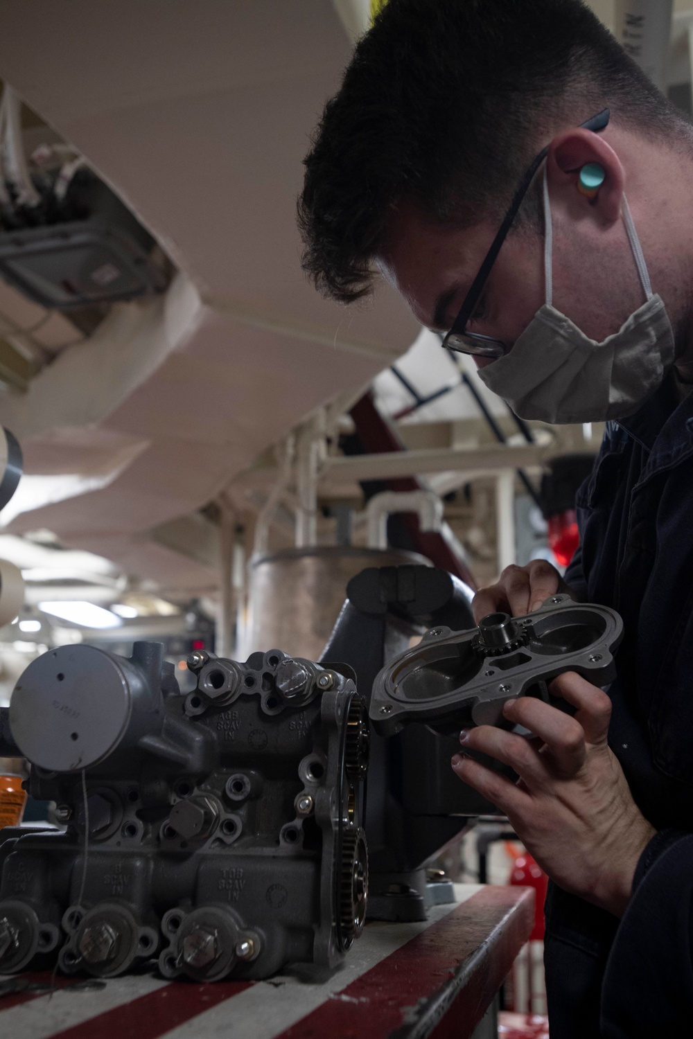 USS Ralph Johnson Sailors Inspect Scavenge Pump