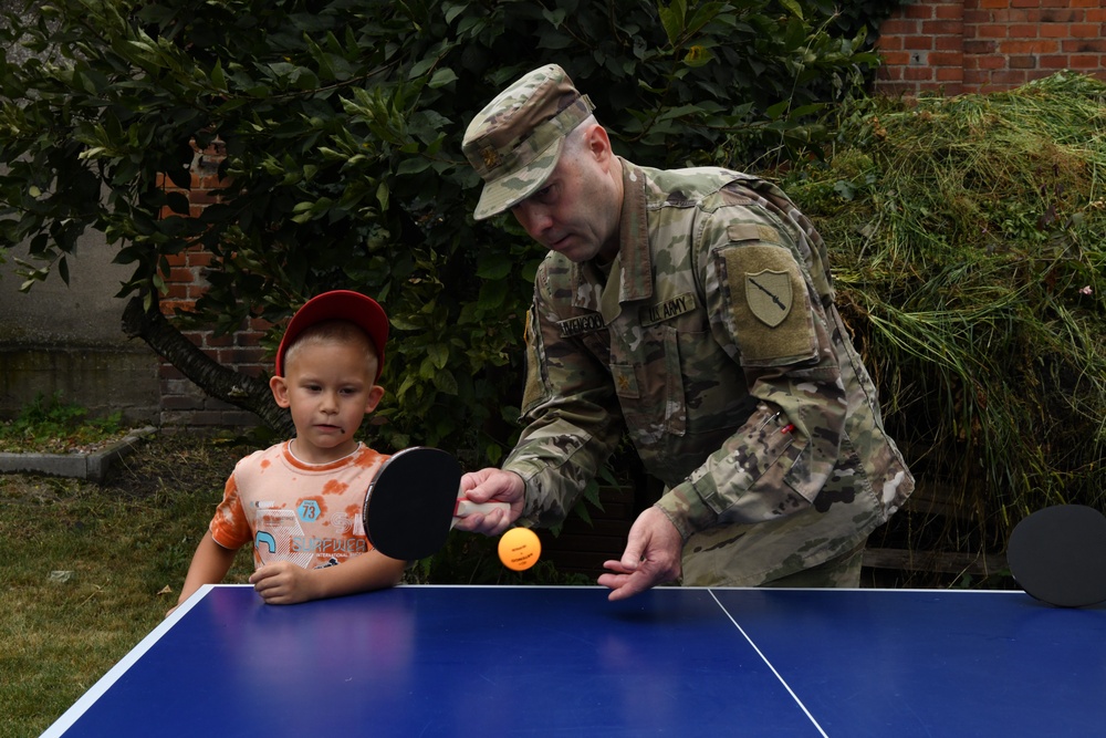 Kentucky Army National Guard Major Livengood gives pingpong lessons