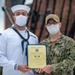 Seaman Nathan Roth receives an award aboard USS Constitution