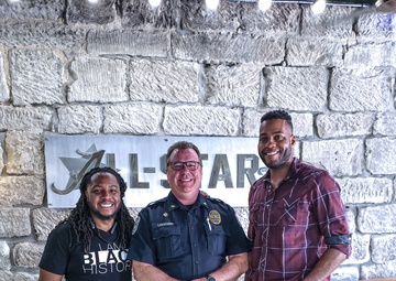 Team Whiteman Airman takes photo with local community members