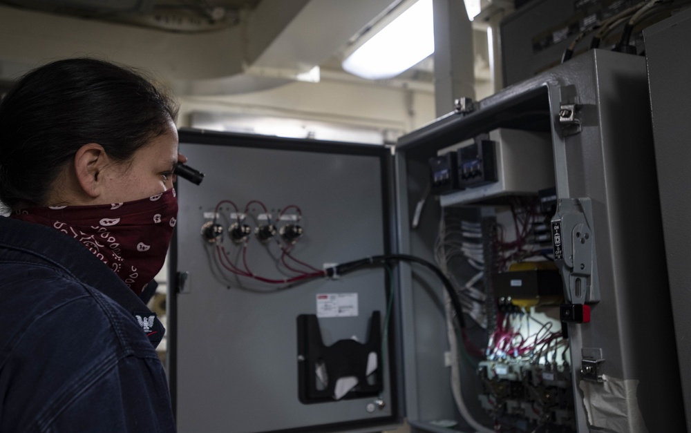 USS Ralph Johnson Sailors inspects electrical motor
