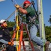 Electronic maintenance teams practice tower climbing to keep base communications flowing