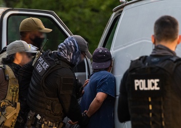 ERO officers apprehend a criminal alien target in northern Virginia during a Cross Check operation.