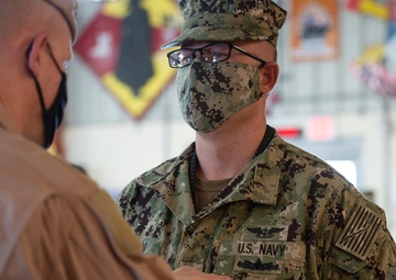 CAMP LEMONNIER HOLDS AWARDS CEREMONY PINNING SAILORS, SOLDIERS