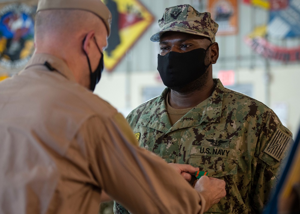 CAMP LEMONNIER HOLDS AWARDS CEREMONY PINNING SAILORS, SOLDIERS