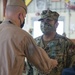 CAMP LEMONNIER HOLDS AWARDS CEREMONY PINNING SAILORS, SOLDIERS