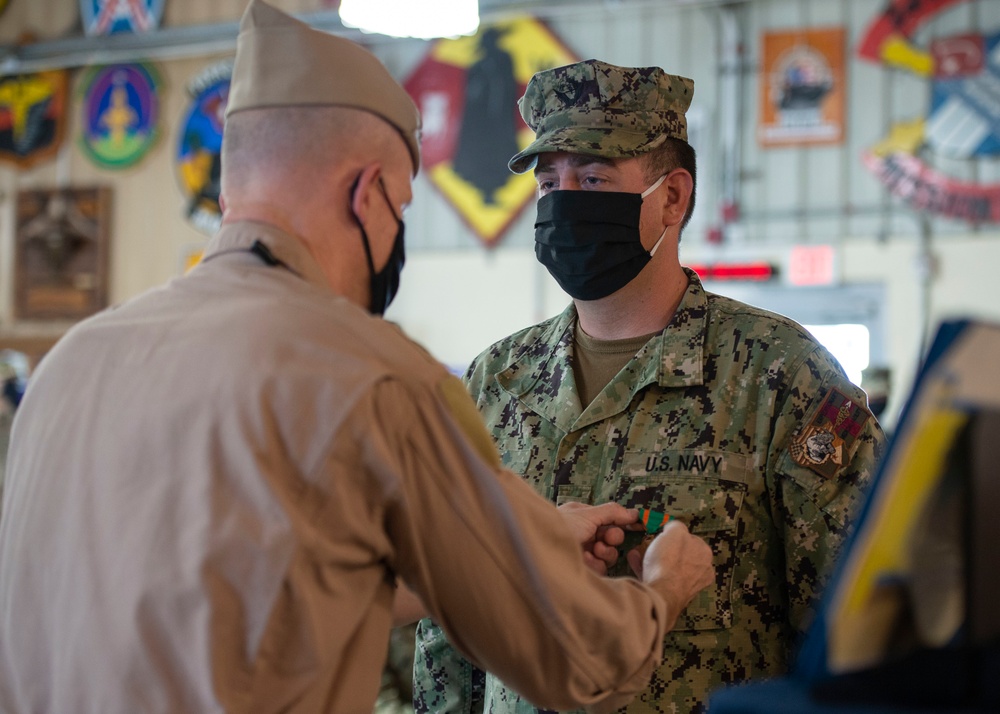 CAMP LEMONNIER HOLDS AWARDS CEREMONY PINNING SAILORS, SOLDIERS