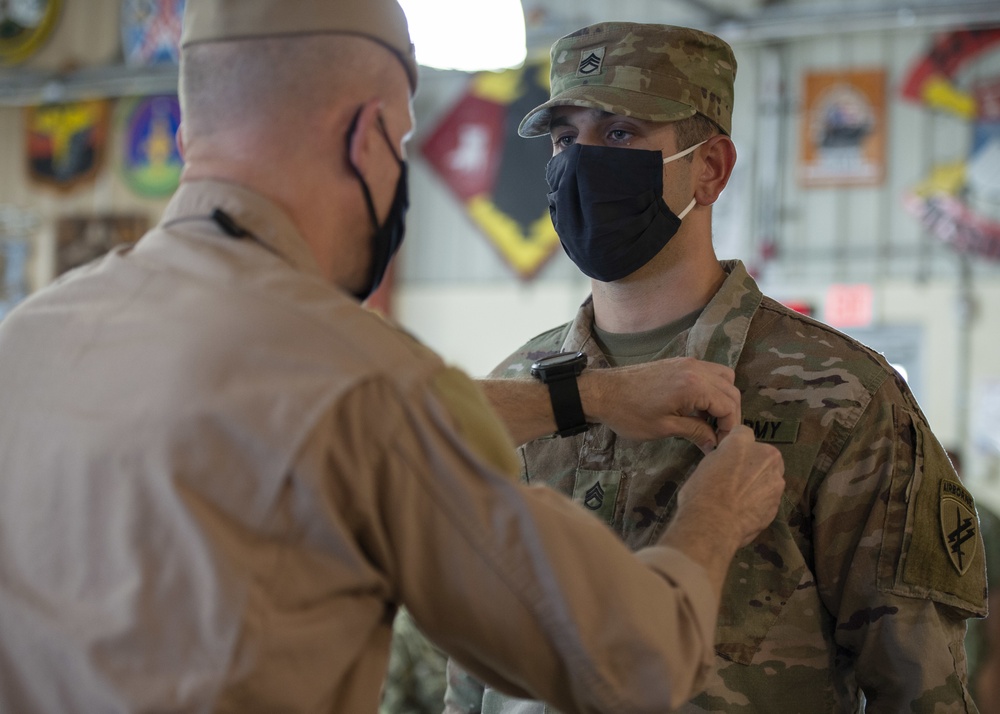 CAMP LEMONNIER HOLDS AWARDS CEREMONY PINNING SAILORS, SOLDIERS