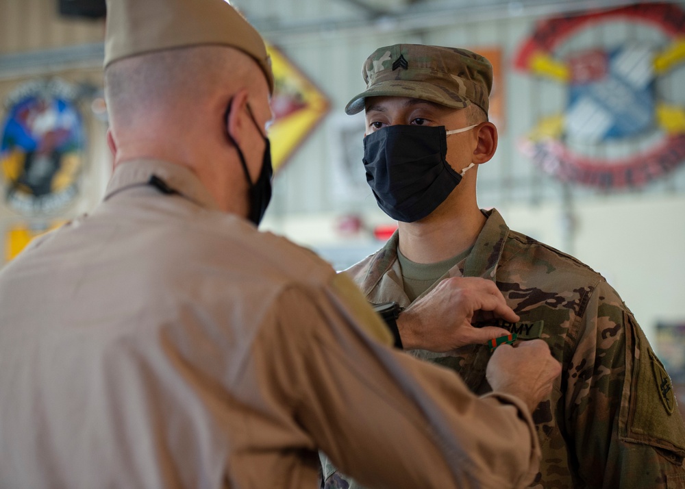 CAMP LEMONNIER HOLDS AWARDS CEREMONY PINNING SAILORS, SOLDIERS