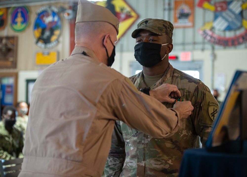 CAMP LEMONNIER HOLDS AWARDS CEREMONY PINNING SAILORS, SOLDIERS