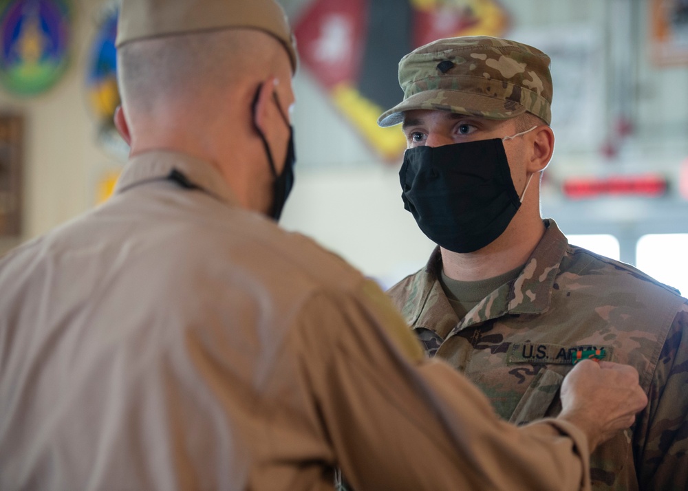 CAMP LEMONNIER HOLDS AWARDS CEREMONY PINNING SAILORS, SOLDIERS